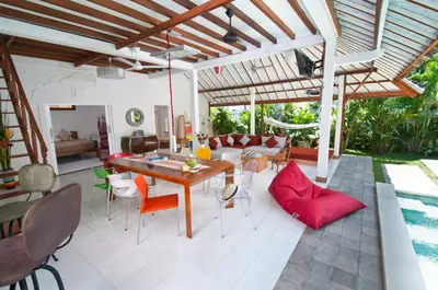 a living room with a table and chairs at 3BR Villa Hari - Special Stay Bonus - Minggu Villas Seminyak in Seminyak