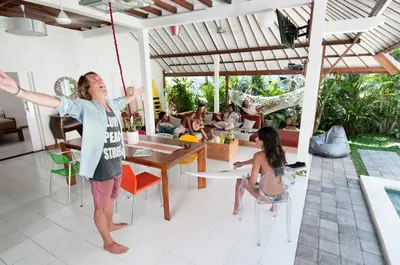 a man hanging from a rope in a house at 3BR Villa Hari - Special Stay Bonus - Minggu Villas Seminyak in Seminyak