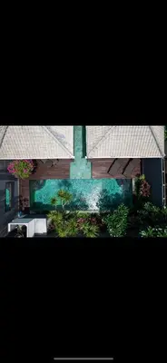 a view of a house with a kitchen and plants at Villa Giulia in Seminyak