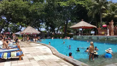 a group of people in a swimming pool at Private Apartments at Jayakarta Resort in Legian
