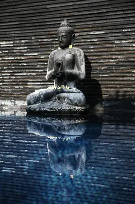 a statue in the water in front of a building at Sunset Paradise Villa Jimbaran 8008 in Jimbaran