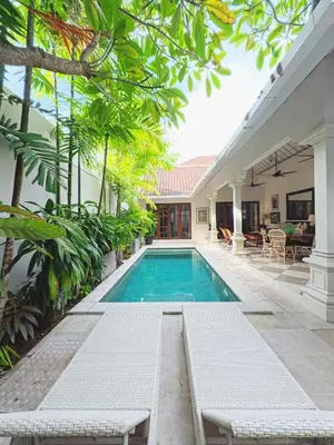 a swimming pool in the backyard of a house at Villa Antiga 2 in Seminyak