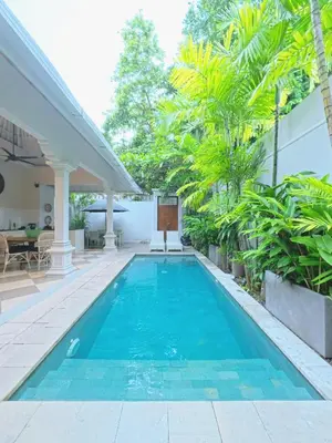 a swimming pool in the backyard of a house at Villa Antiga 2 in Seminyak