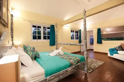 a bedroom with a canopy bed with a stuffed animal on it at Villa Alam Biru Gardenia in Seminyak