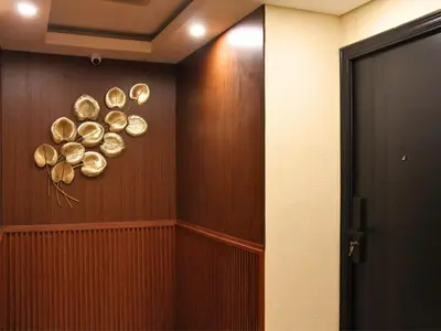 a hallway with copper plates on the wall at AB Hotel Kuta in Kuta