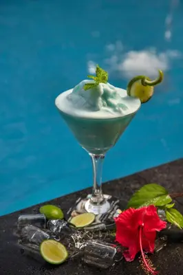 a drink in a martini glass on a table at Legian Village Beach Resort - CHSE Certified in Legian