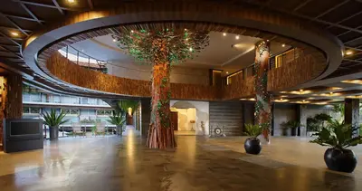 a lobby with trees and plants in a building at The Crystal Luxury Bay Resort Nusa Dua in Nusa Dua