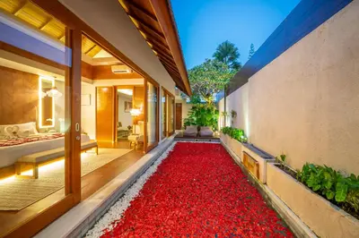 a large red rug in the hallway of a house at Sithala Villa Seminyak in Seminyak