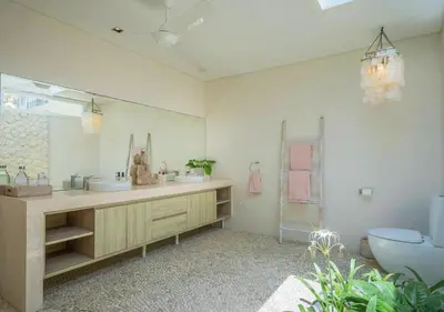 a bathroom with two sinks and a toilet at Bali Villa Beachfront Luxe Rooftop Sunsets in Canggu