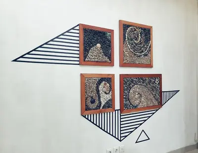a wall with four pictures on a wall at Nuka Beach Inn in Kuta