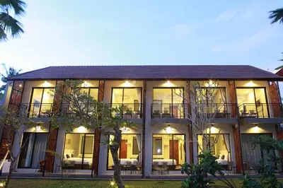 a large building with a lot of windows at Adys Inn in Legian