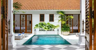 a swimming pool in the middle of a villa at Villa Wahah in Seminyak