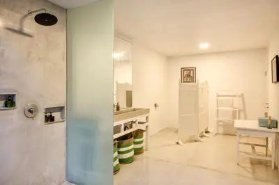 a white bathroom with a sink and a refrigerator at Villa EMMA | heart of Seminyak | 350m Beach in Seminyak