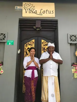 a man and woman standing in front of a door at Bali Villa Lotus in Seminyak