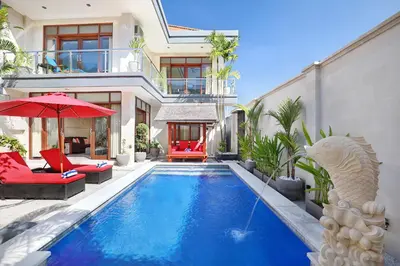 a swimming pool in the backyard of a house at Villa Nova in Legian