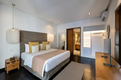 a bedroom with a large bed in a room at Villa Dee 6 in Seminyak