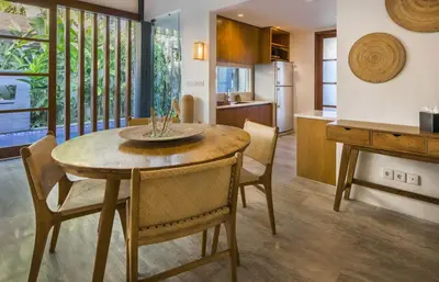 a kitchen and dining room with a table and chairs at Villa Dee 6 in Seminyak