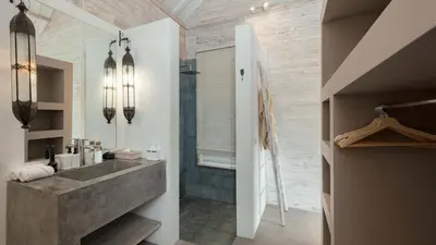 a bathroom with a sink and a shower at Villa Du Ho by Villa Finder in Kerobokan