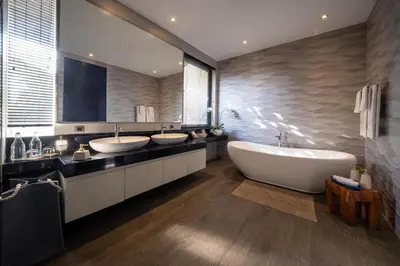 a bathroom with two sinks and a large tub at Villa Balimu Seminyak in Seminyak