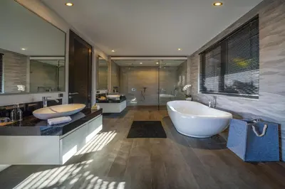 a large bathroom with two sinks and a tub at Villa Balimu Seminyak in Seminyak