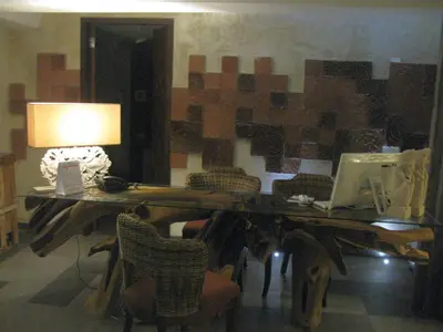 a desk with a laptop and a lamp on it at Anshel Hotel Seminyak in Seminyak