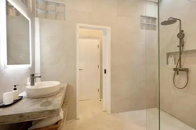 a bathroom with a sink and a shower at Villa Alba in Seminyak