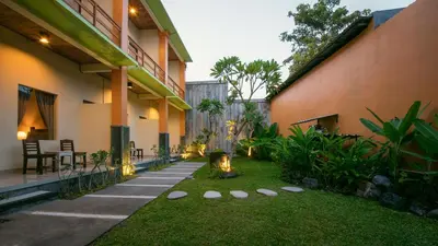 a courtyard of a house with a garden at The Rani Garden Bed & Breakfast in Denpasar