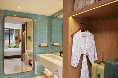 a bathroom with a sink and a mirror at Kleo Seminyak, part of JdV by Hyatt in Seminyak