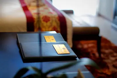 a table with two cards on top of it at Royal Tulip Springhill Resort Jimbaran in Jimbaran