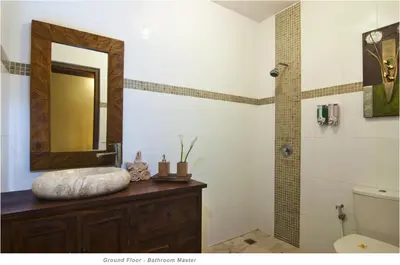 a bathroom with a sink and a mirror at 2BR Villa Senin - Minggu Villas Seminyak in Seminyak