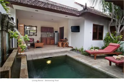a house with a swimming pool in the yard at 2BR Villa Senin - Minggu Villas Seminyak in Seminyak