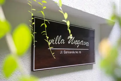 a sign on a wall that reads villa universanza at Villa Ungava in Seminyak