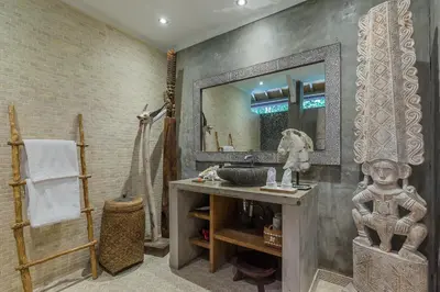 a bathroom with a sink and a mirror at Villa Kundalini in Seminyak
