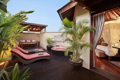 a living room with a patio with plants at Kanishka Villas in Seminyak