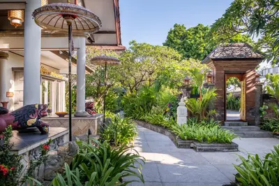 a garden in front of a house at Kuta Seaview Beach Resort in Kuta