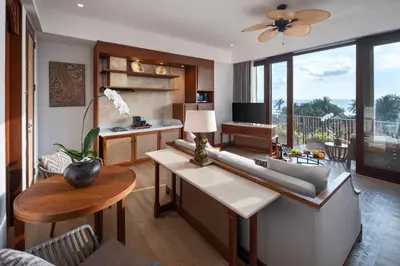 a living room with a couch and a table at Kuta Seaview Beach Resort in Kuta
