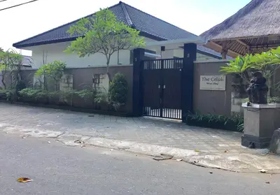 a gate in front of a house with a fence at The Celuk Homestay in Jimbaran