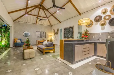 a large room with a kitchen and a living room at Villa Irma in Seminyak