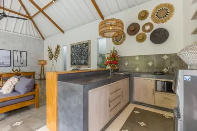 a kitchen with a sink and a counter top at Villa Irma in Seminyak