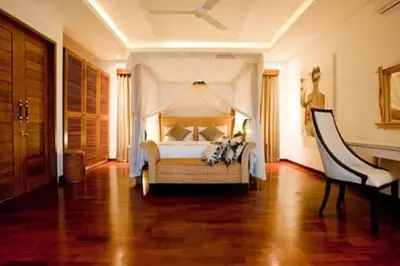 a bedroom with a bed with a canopy at Villa Anema Umalas in Seminyak