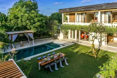 an aerial view of a backyard with a pool and a house at Villa Seriska Jimbaran - Spacious 5BR Private Pool Villa with Private Cook, Spa & Tour in Jimbaran