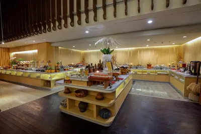 a large kitchen with a lot of food on display at THE HAVEN Bali Seminyak in Seminyak