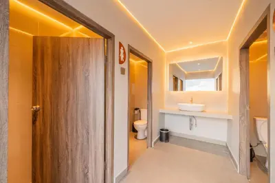 a bathroom with a toilet and a sink at Stark Boutique Hotel and Spa in Kuta