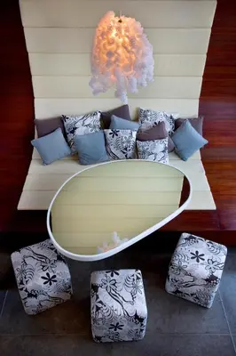 a rendering of a couch with a surfboard on it at Kiss Bali Villas in Seminyak