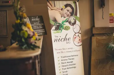 a sign for a mingle ball on a wall at The Niche Bali in Legian