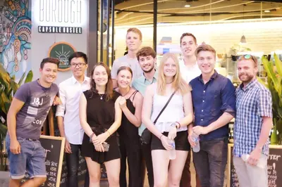 a group of people posing for a picture at Borough Capsule Hostel Bali in Legian