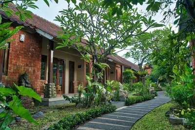 a house with a garden and a walkway at The Garden Villa in Sanur
