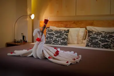 a swan made out of towels on a bed at The Seiryu Boutique Bali Villas in Seminyak
