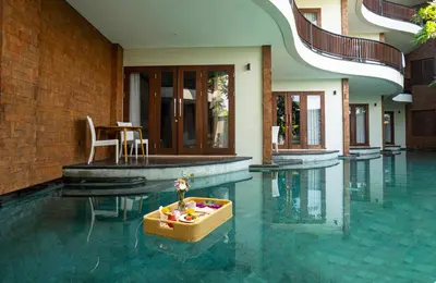 a basket of fruit in the middle of a swimming pool at djabu Seminyak Hotel in Seminyak