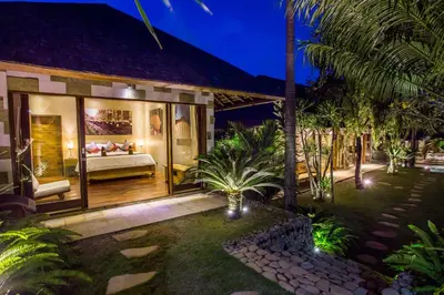 a villa with a bed in a room at Rachline Villa in Kerobokan